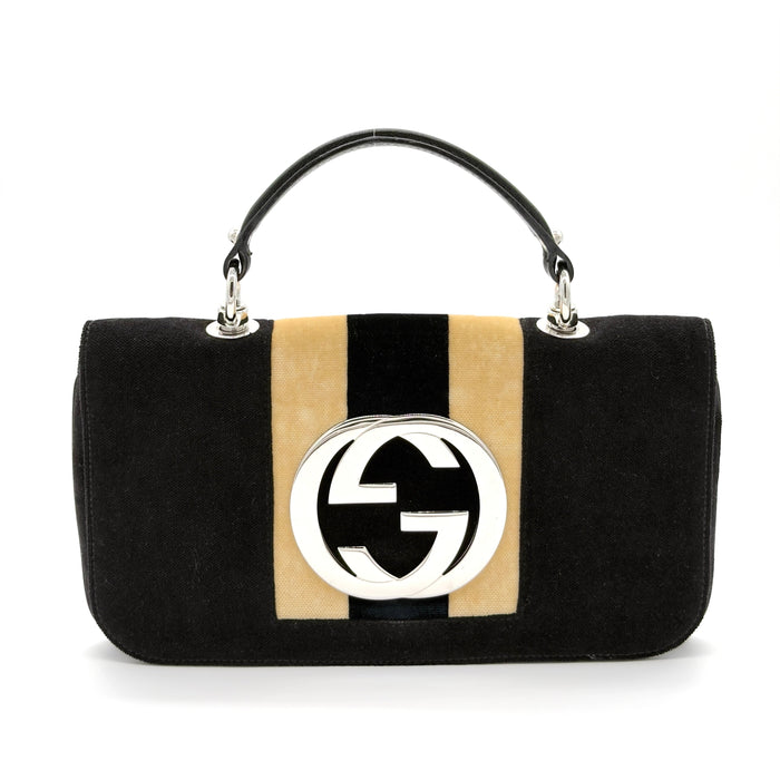 Black handbag with beige stripe and logo on a white background