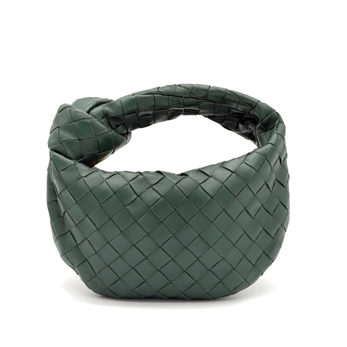 Green woven handbag on a white background