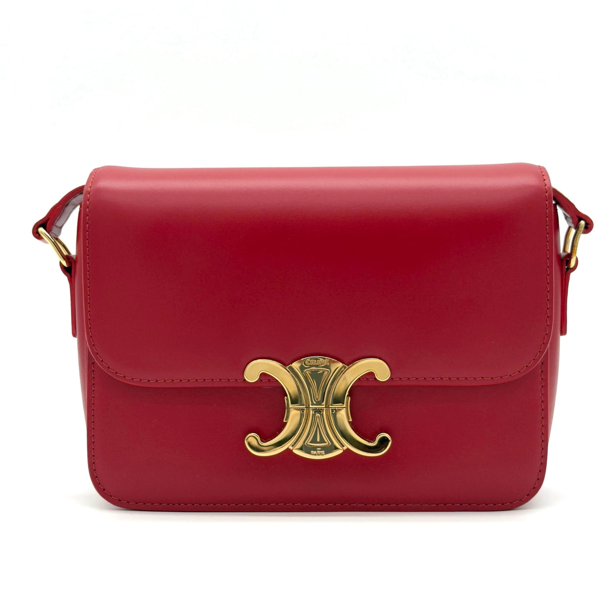 Red handbag with a gold clasp on a white background
