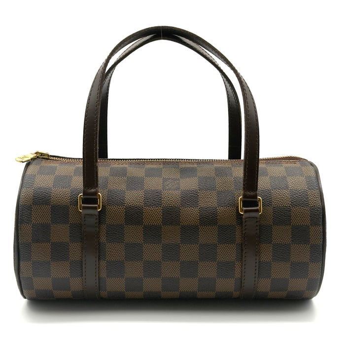 Brown checkered handbag with black handles on a white background